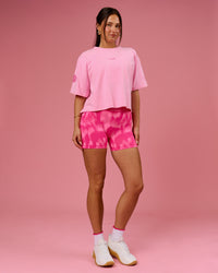 Woman wearing Go-To Heavyweight FLXCotton Graphic Skimmer Tee - Pink Rose-We Rise | Model:Bianca | Size:S | Thumbnail Index: 4