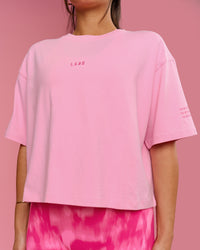 Woman wearing Go-To Heavyweight FLXCotton Graphic Skimmer Tee - Pink Rose-We Rise | Model:Bianca | Size:S | Thumbnail Index: 13