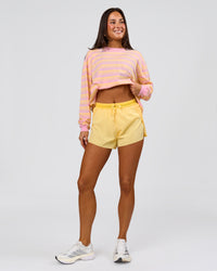 Woman wearing Go-To Shadow Stripe Long Sleeve FLXCotton Oversized Tee - Lemon-Marshmallow | Model:Bianca | Size:S | Thumbnail Index: 4