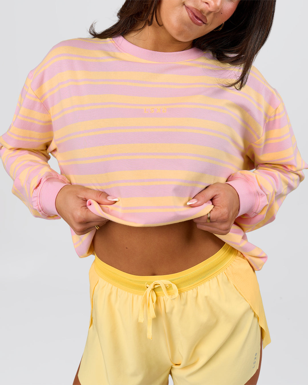 Woman wearing Go-To Shadow Stripe Long Sleeve FLXCotton Oversized Tee - Lemon-Marshmallow | Model:Bianca | Size:S - view 9