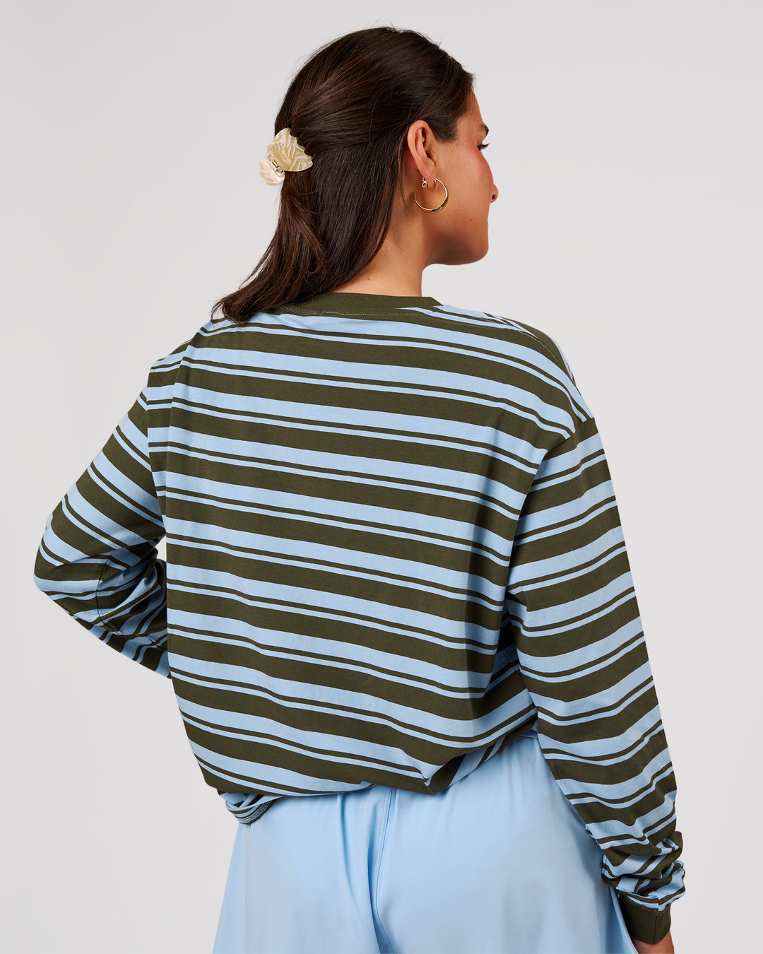 Woman wearing Go-To Shadow Stripe Long Sleeve FLXCotton Oversized Tee - Pure Olive-Open Air | Model:Bianca | Size:S - view 4
