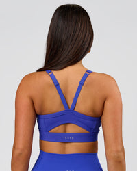 Woman wearing Momentum Sports Bra D/DD/E - Power Cobalt | Model:Bianca | Size:S | Thumbnail Index: 0