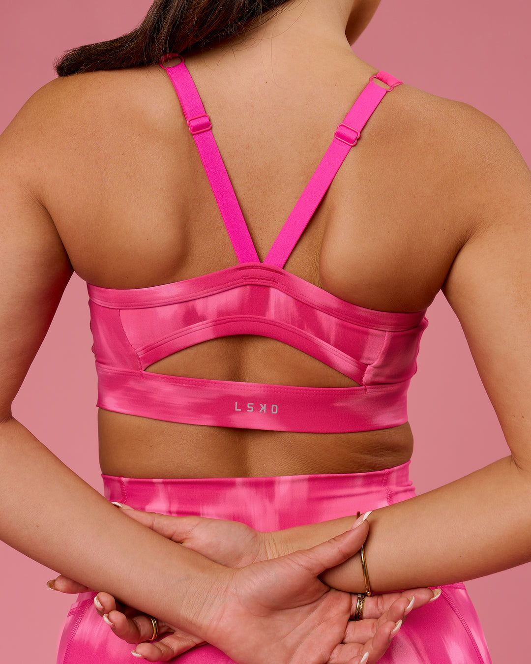 Woman wearing Momentum Sports Bra D/DD/E - Radiant Pink | Model:Bianca | Size:S - view 2