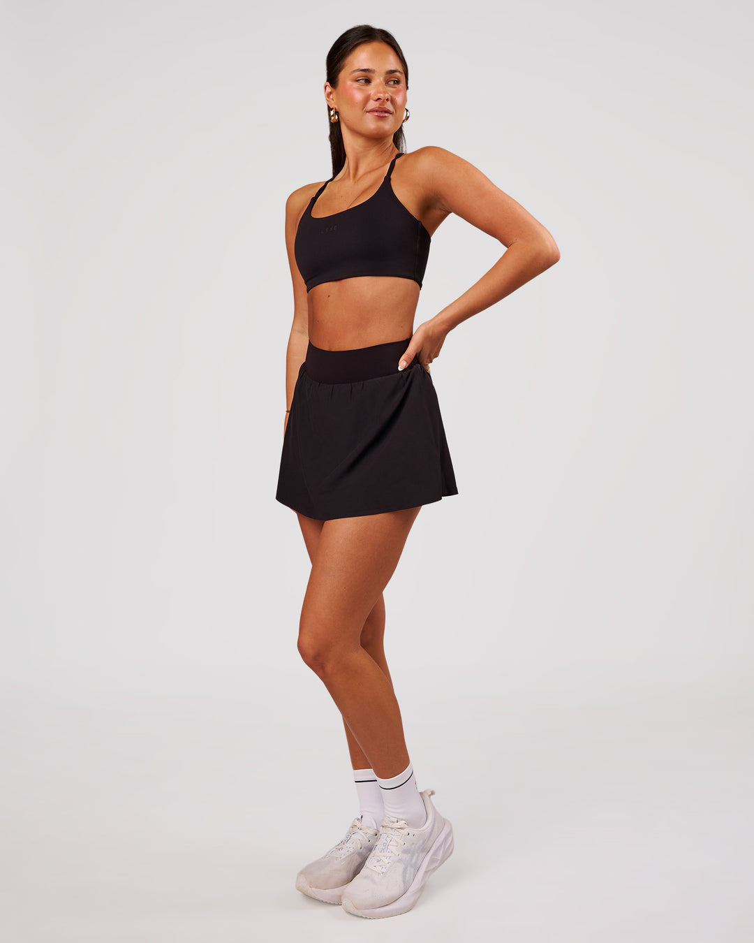 Woman wearing Pacer Skirt - Black | Model:Bianca | Size:S - view 3