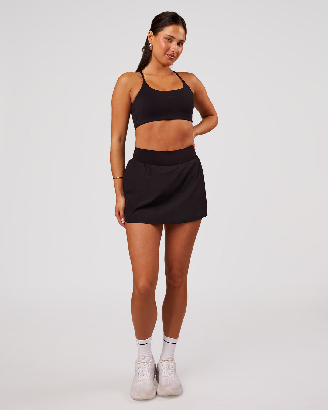 Woman wearing Pacer Skirt - Black | Model:Bianca | Size:S - view 9