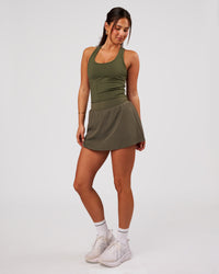 Woman wearing Pacer Skirt - Pure Olive | Model:Bianca | Size:S | Thumbnail Index: 3