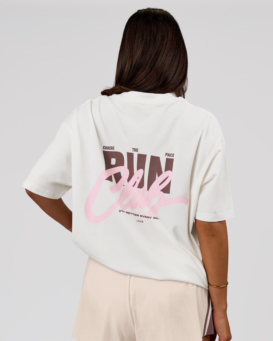 Woman wearing Run Club Unisex Oversized Heavyweight FLXCotton Tee - Off White | Model:Bianca | Size:S - view 6