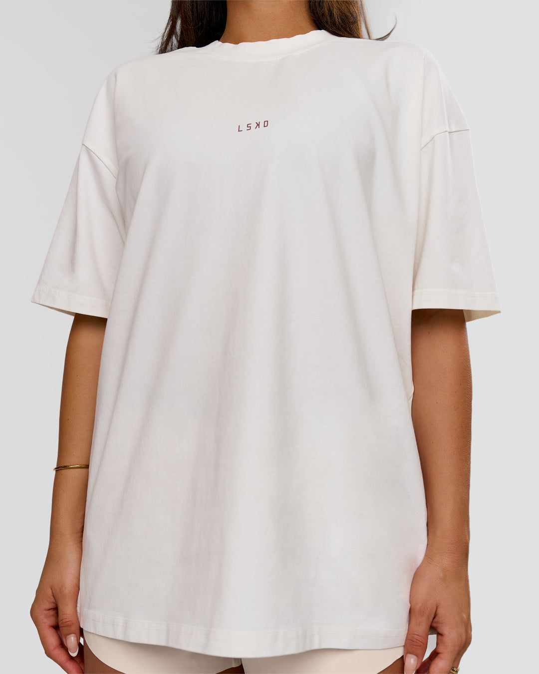 Woman wearing Run Club Unisex Oversized Heavyweight FLXCotton Tee - Off White | Model:Bianca | Size:S - view 9
