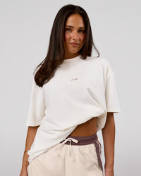 Woman wearing Run Club Unisex Oversized Heavyweight FLXCotton Tee - Off White | Model:Bianca | Size:S | Thumbnail Index: 7