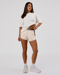 Woman wearing Run Club Unisex Oversized Heavyweight FLXCotton Tee - Off White | Model:Bianca | Size:S | Thumbnail Index: 11