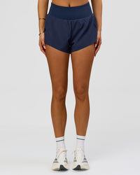 Woman wearing Tia-Clair Toomey-Orr Accelerate 3" Storage Running Short - Future Navy | Model:Bianca | Size:S | Thumbnail Index: 6