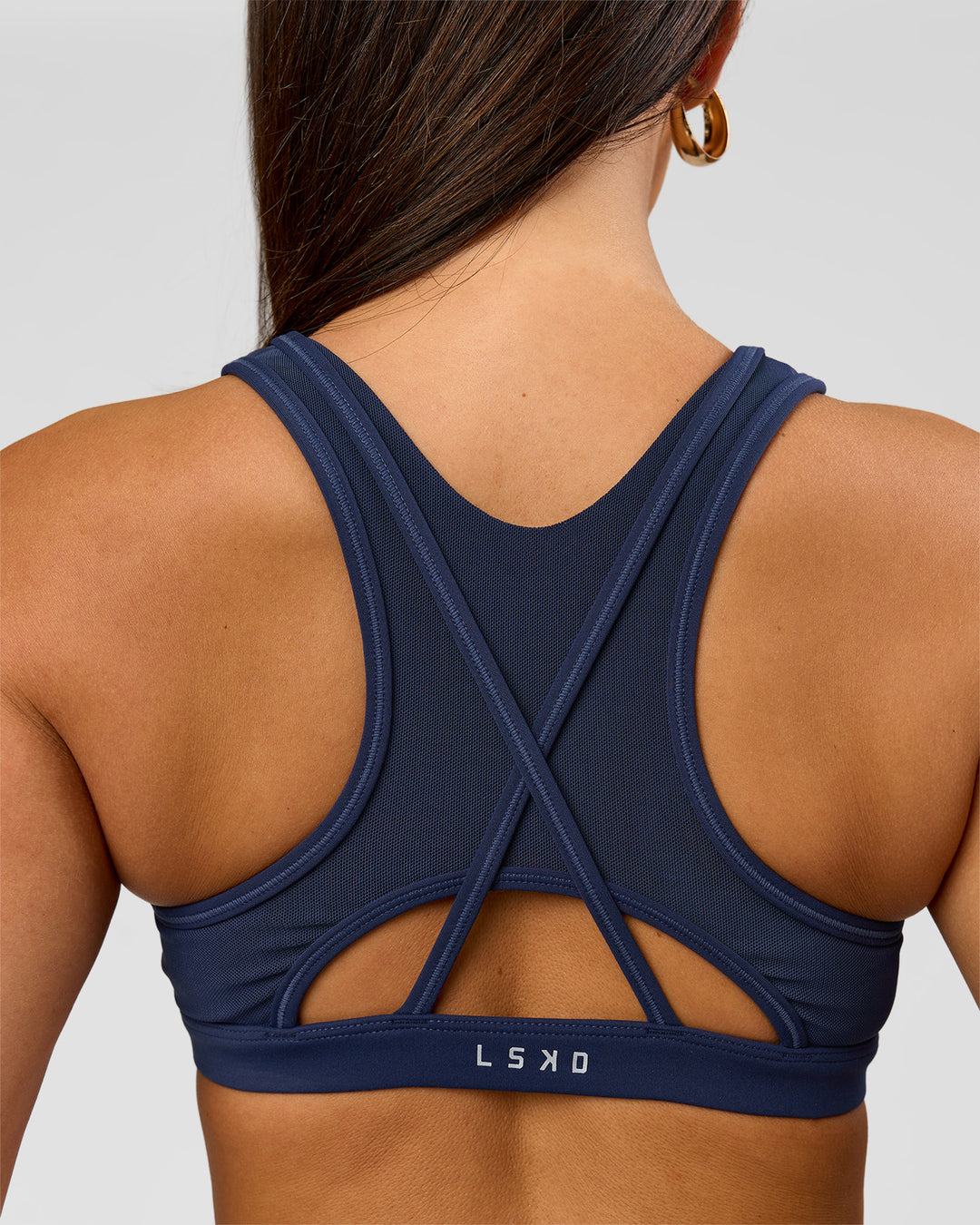 Woman wearing Unstoppable Racerback Sports Bra - Future Navy | Model:Bianca | Size:S - view 8