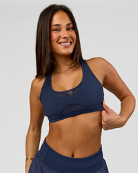 Woman wearing Unstoppable Racerback Sports Bra - Future Navy | Model:Bianca | Size:S | Thumbnail Index: 8