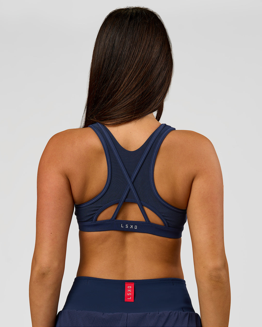 Woman wearing Unstoppable Racerback Sports Bra - Future Navy | Model:Bianca | Size:S - view 6