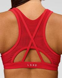 Woman wearing Unstoppable Racerback Sports Bra - Scarlet | Model:Bianca | Size:S | Thumbnail Index: 1