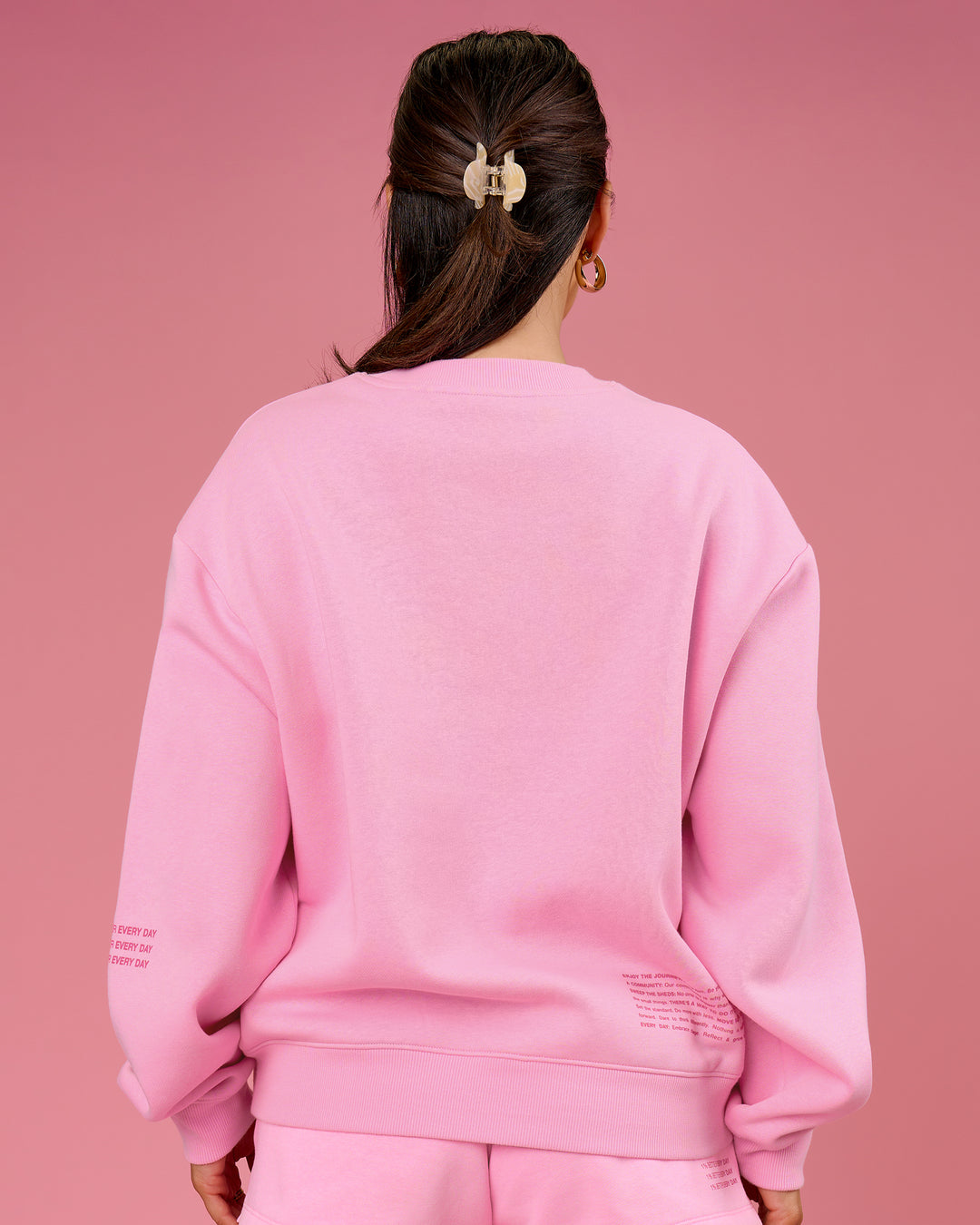Woman wearing We Rise Oversized Sweater - Pink Rose-We Rise | Model:Bianca | Size:S - view 2