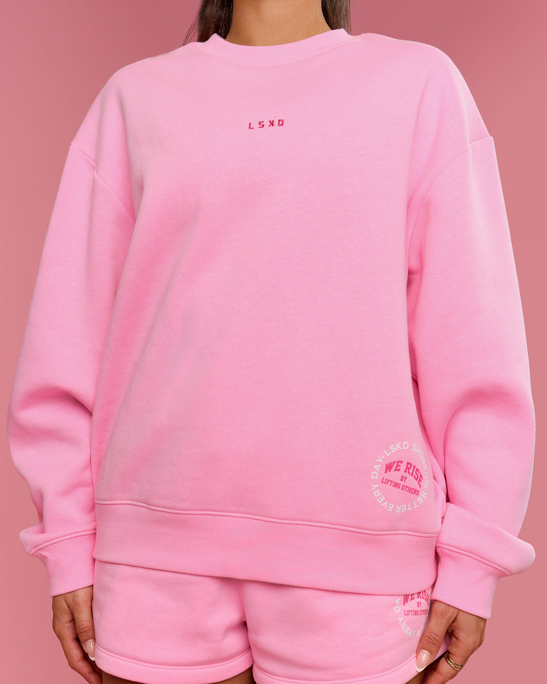 Woman wearing We Rise Oversized Sweater - Pink Rose-We Rise | Model:Bianca | Size:S - view 3