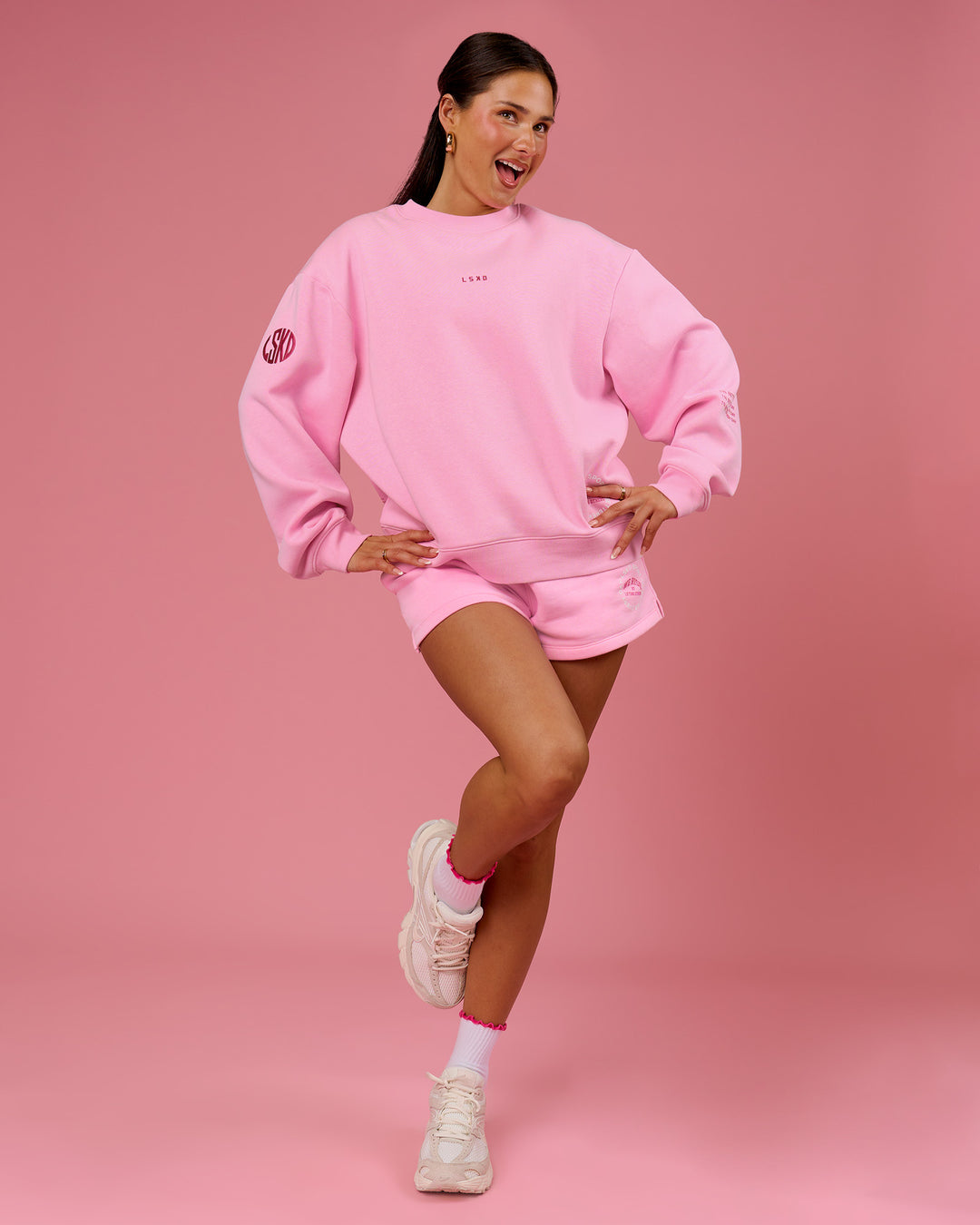 Woman wearing We Rise Oversized Sweater - Pink Rose-We Rise | Model:Bianca | Size:S - view 10