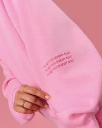 Woman wearing We Rise Oversized Sweater - Pink Rose-We Rise | Model:Bianca | Size:S | Thumbnail Index: 10