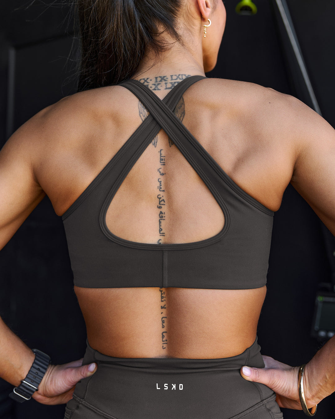 Woman wearing Stamina Sports Bra - Onyx | Model:Chelsea | Size:S - view 7
