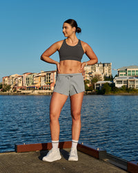 Woman wearing Accelerate Sports Bra - Onyx | Model:Emily | Size:S | Thumbnail Index: 7