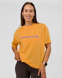 Woman wearing VS6 1% Better Fathers Day FLXCotton Oversized Tee - Warm Apricot | Model:Jess | Size:S | Thumbnail Index: 2
