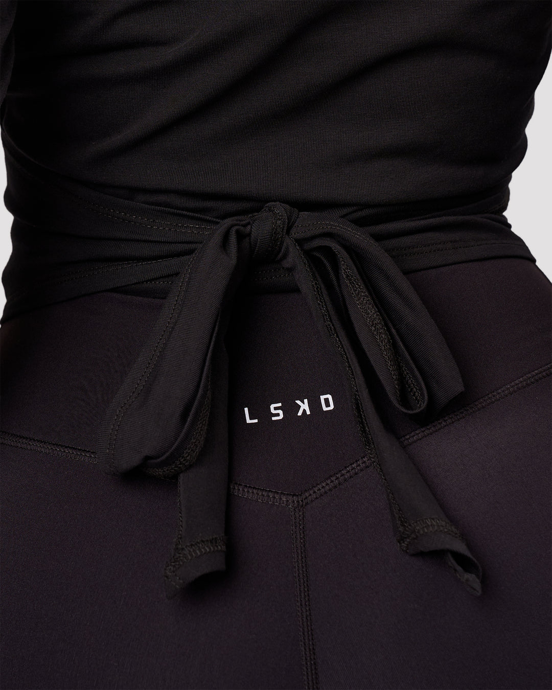 Woman wearing All Day Wrap FLXCotton Long Sleeve Top - Black | Model:Jordan | Size:S - view 6