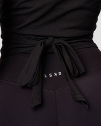 Woman wearing All Day Wrap FLXCotton Long Sleeve Top - Black | Model:Jordan | Size:S | Thumbnail Index: 5