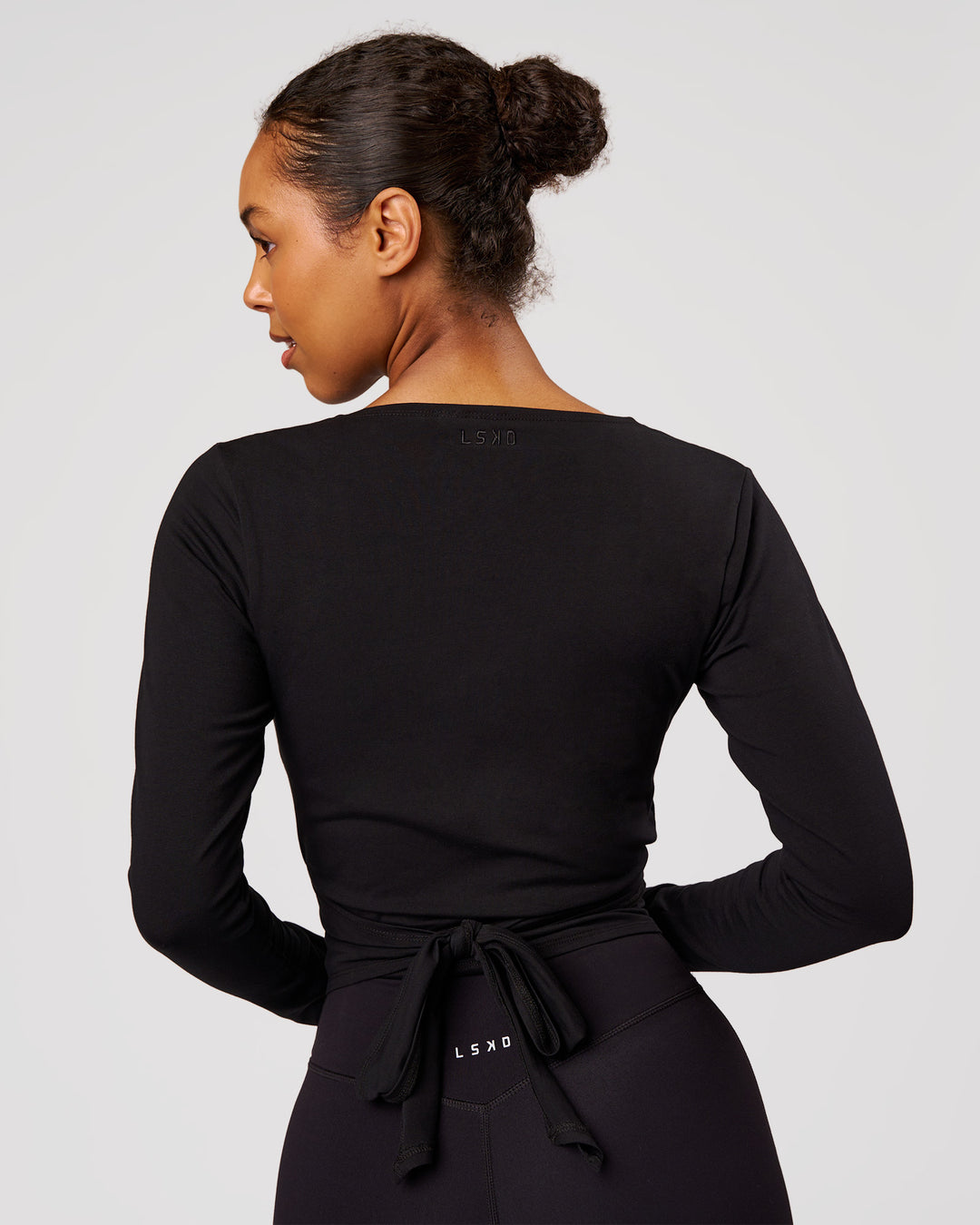 Woman wearing All Day Wrap FLXCotton Long Sleeve Top - Black | Model:Jordan | Size:S - view 4