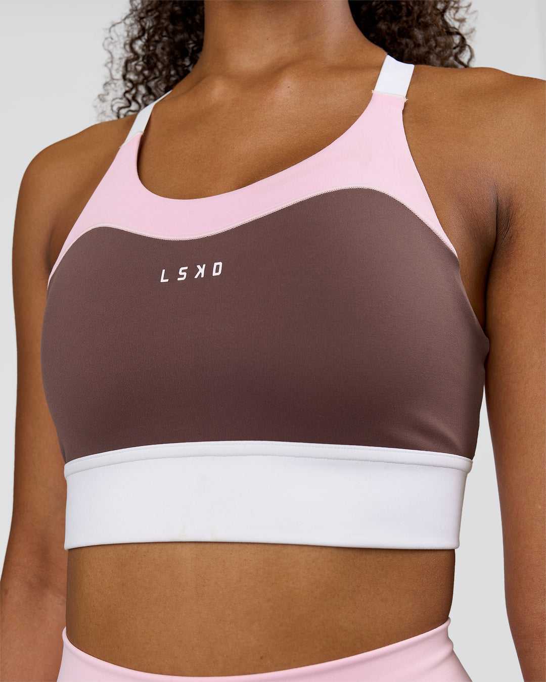 Woman wearing Elevated Accelerate Sports Bra - Cocoa Powder-Marshmallow-White | Model:Jordan | Size:S - view 1