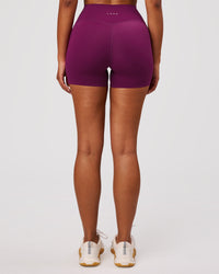 Woman wearing Elixir High-Rise 4" Short Pockets - Plum Caspia | Model:Jordan | Size:S | Thumbnail Index: 3
