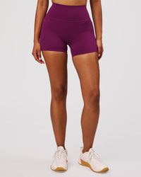 Woman wearing Elixir High-Rise 4" Short Pockets - Plum Caspia | Model:Jordan | Size:S | Thumbnail Index: 4