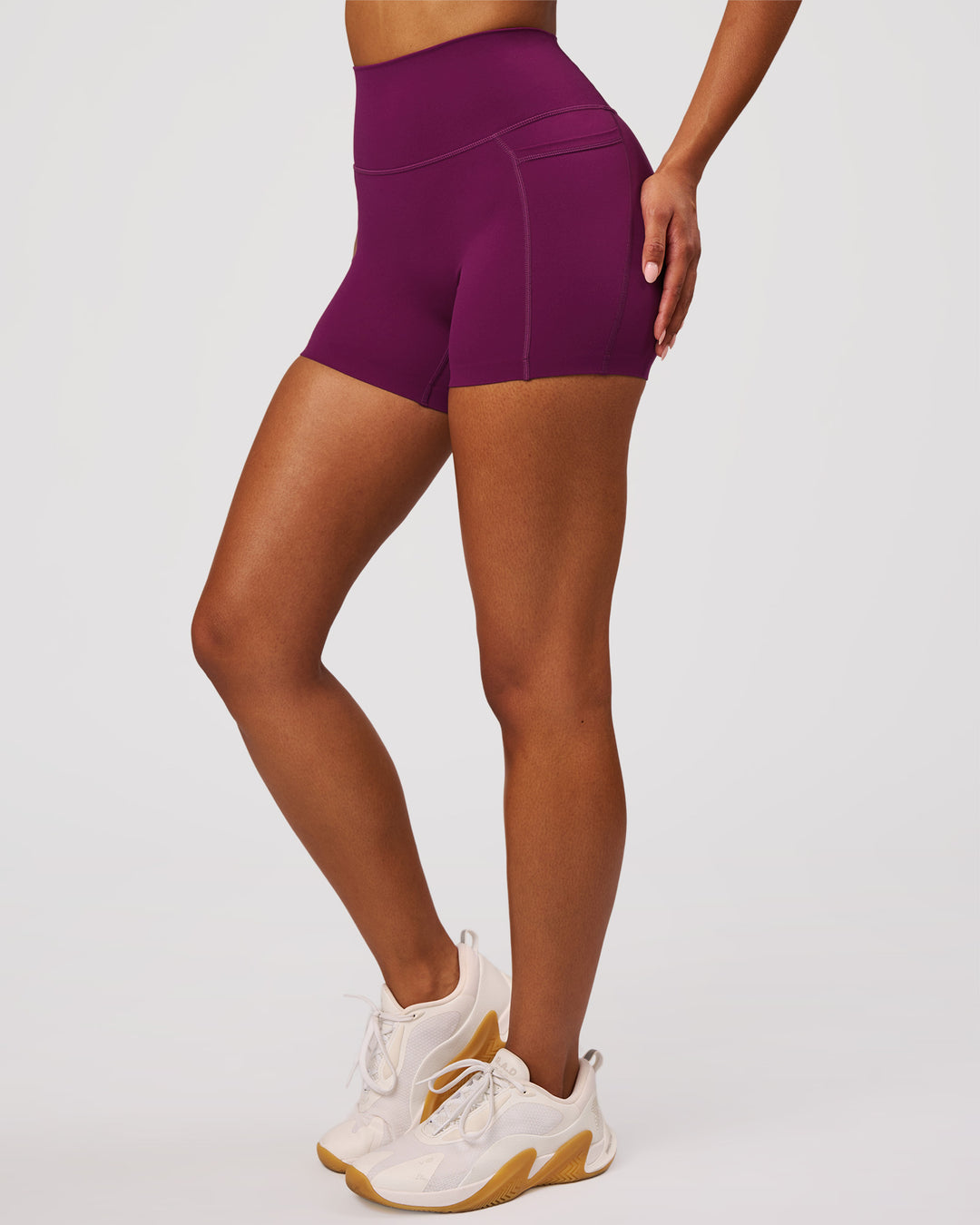 Woman wearing Elixir High-Rise 4" Short Pockets - Plum Caspia | Model:Jordan | Size:S - view 7