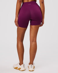 Woman wearing Elixir High-Rise 6" Short Pockets - Plum Caspia | Model:Jordan | Size:S | Thumbnail Index: 6