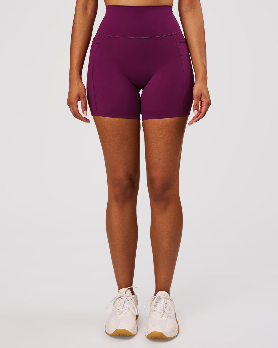 Woman wearing Elixir High-Rise 6" Short Pockets - Plum Caspia | Model:Jordan | Size:S - view 8