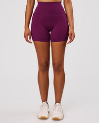 Woman wearing Elixir High-Rise 6" Short Pockets - Plum Caspia | Model:Jordan | Size:S | Thumbnail Index: 7