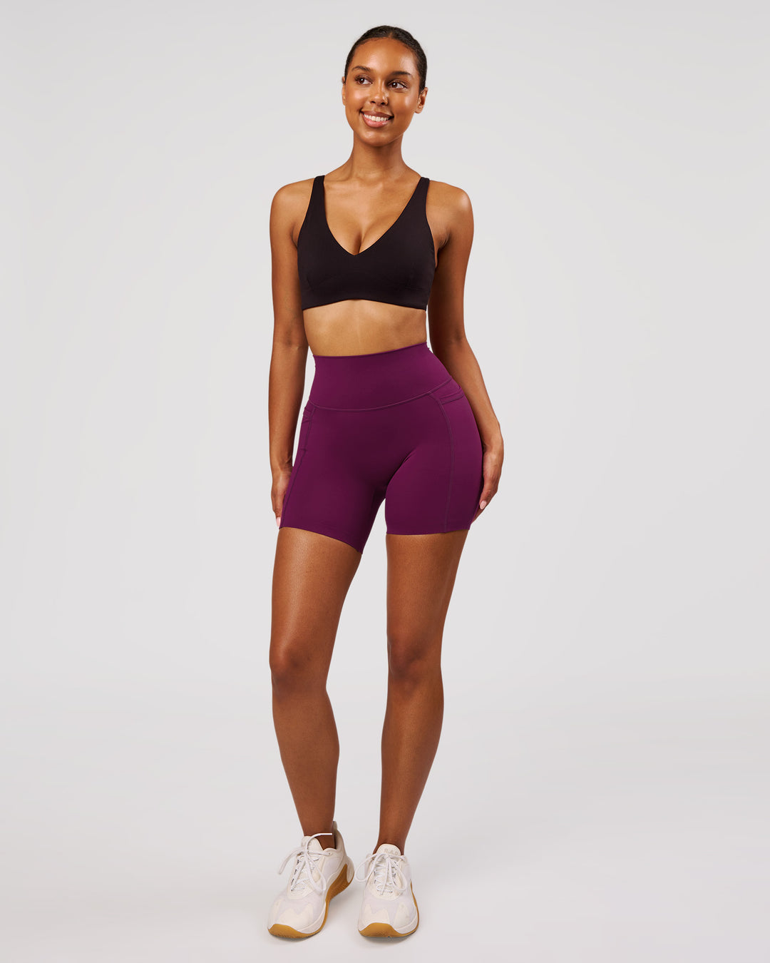 Woman wearing Elixir High-Rise 6" Short Pockets - Plum Caspia | Model:Jordan | Size:S - view 4