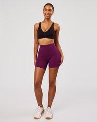 Woman wearing Elixir High-Rise 6" Short Pockets - Plum Caspia | Model:Jordan | Size:S | Thumbnail Index: 3