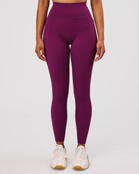 Woman wearing Elixir High-Rise Full Length Legging Pockets - Plum Caspia | Model:Jordan | Size:S | Thumbnail Index: 0