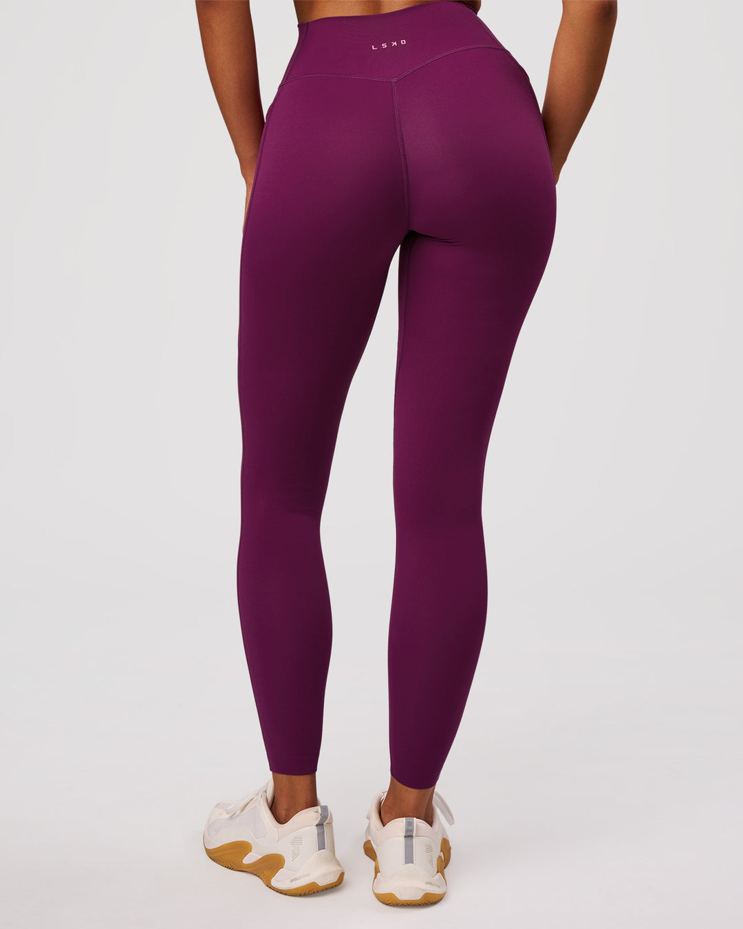 Woman wearing Elixir High-Rise Full Length Legging Pockets - Plum Caspia | Model:Jordan | Size:S - view 2