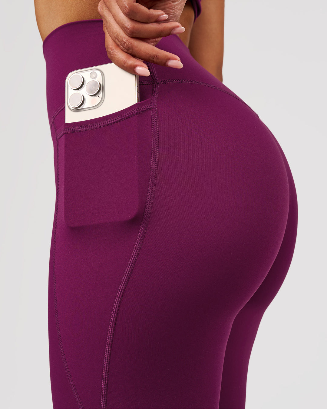 Woman wearing Elixir High-Rise Full Length Legging Pockets - Plum Caspia | Model:Jordan | Size:S - view 5