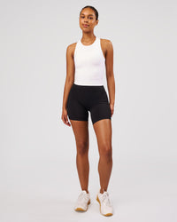 Woman wearing Flow Performance Tank 2.0 - White | Model:Jordan | Size:S | Thumbnail Index: 5