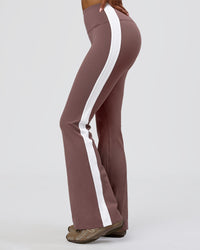 Woman wearing Fusion V-Contour Bind High-Rise Flared Legging - Cocoa Power-White | Model:Jordan | Size:S | Thumbnail Index: 0