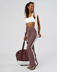 Woman wearing Fusion V-Contour Bind High-Rise Flared Legging - Cocoa Power-White | Model:Jordan | Size:S | Thumbnail Index: 2