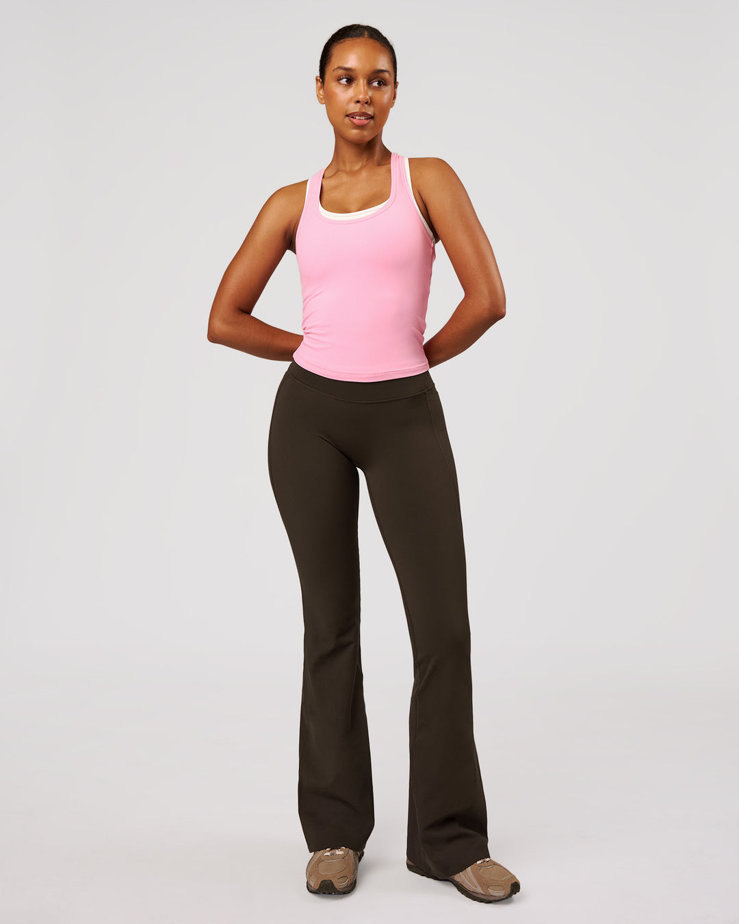 Woman wearing Fusion V-Contour High-Rise Flared Legging Pockets - Ground Coffee | Model:Jordan | Size:S - view 6