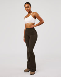 Woman wearing Fusion V-Contour High-Rise Flared Legging Pockets - Ground Coffee | Model:Jordan | Size:S | Thumbnail Index: 7