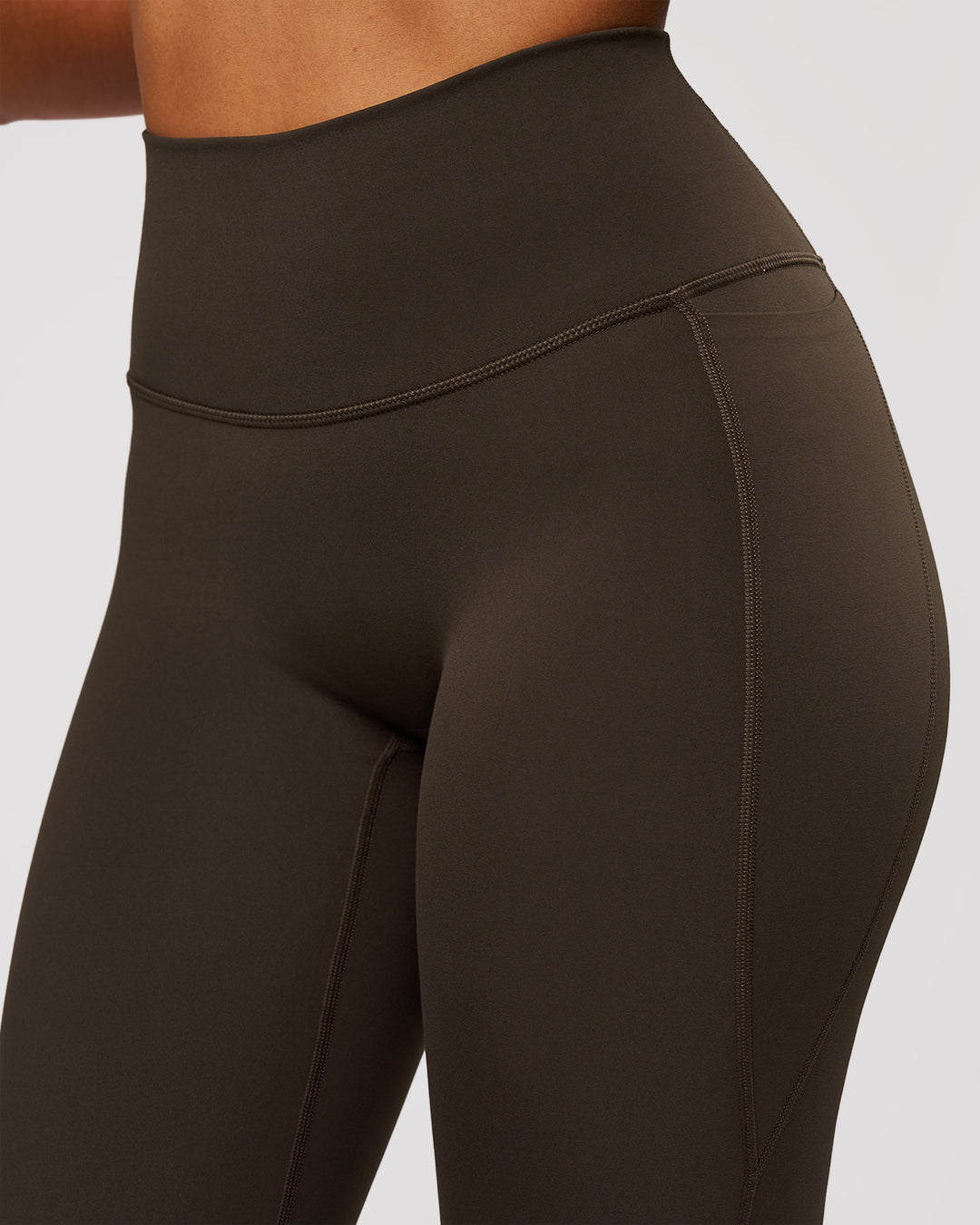 Woman wearing Fusion V-Contour High-Rise Flared Legging Pockets - Ground Coffee | Model:Jordan | Size:S - view 7