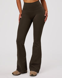 Woman wearing Fusion V-Contour High-Rise Flared Legging Pockets - Ground Coffee | Model:Jordan | Size:S | Thumbnail Index: 8
