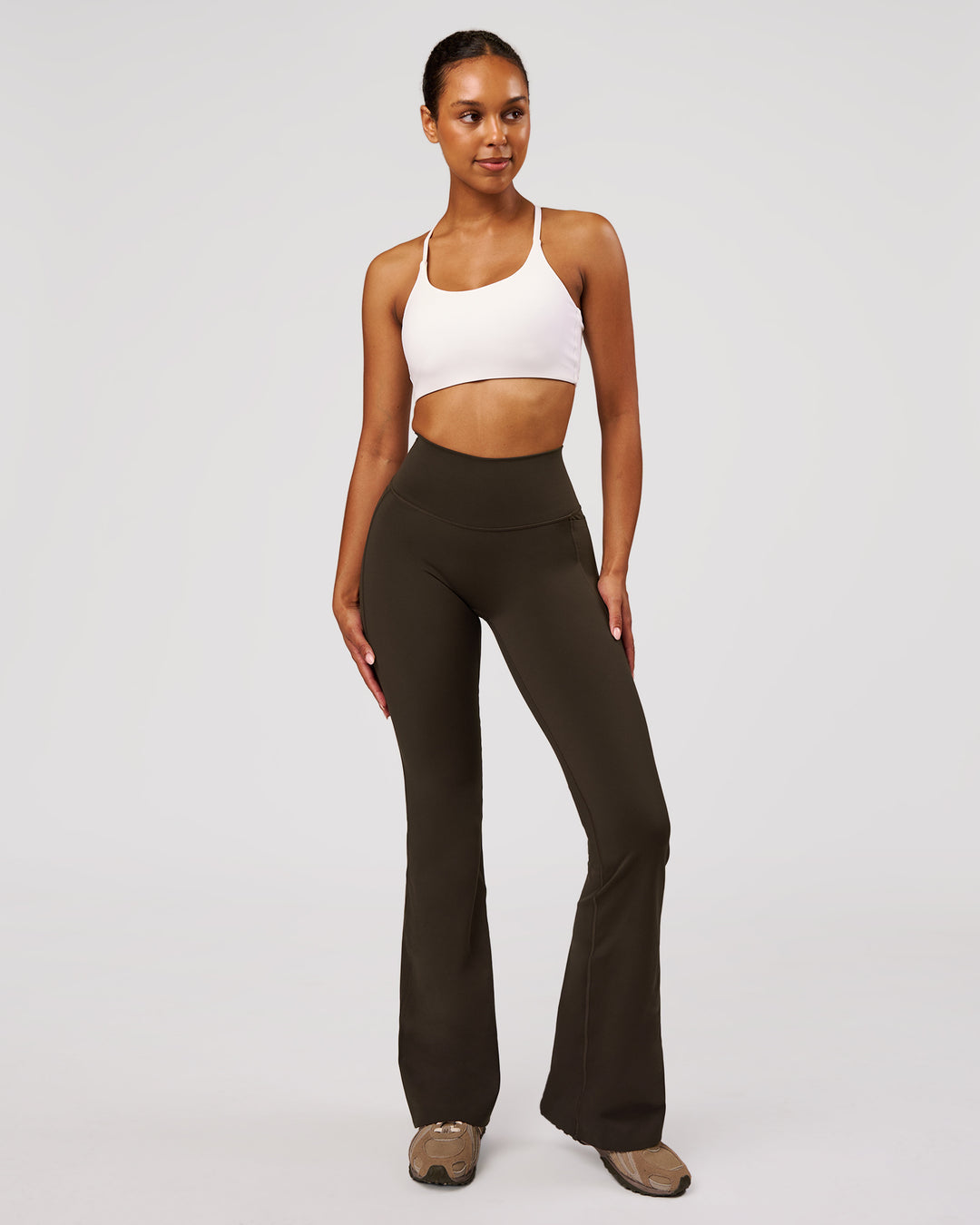 Woman wearing Fusion V-Contour High-Rise Flared Legging Pockets - Ground Coffee | Model:Jordan | Size:S - view 4