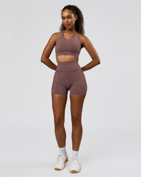 Woman wearing Fusion V-Contour Ultra High-Rise 4" Short Pockets - Cocoa Powder | Model:Jordan | Size:S | Thumbnail Index: 7